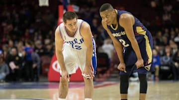 Apr 5, 2016; Philadelphia, PA, USA; Philadelphia 76ers guard T.J. McConnell (12) and New Orleans Pelicans guard Tim Frazier (2) talk on the court during the first quarter at Wells Fargo Center. Mandatory Credit: Bill Streicher-USA TODAY Sports