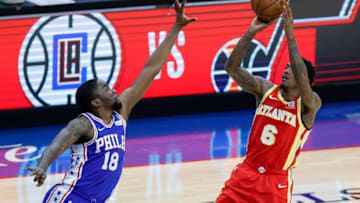 PHILADELPHIA, PENNSYLVANIA - JUNE 08: Lou Williams #6 of the Atlanta Hawks shoots over Shake Milton #18 of the Philadelphia 76ers during the third quarter during Game Two of the Eastern Conference second round series at Wells Fargo Center on June 08, 2021 in Philadelphia, Pennsylvania. NOTE TO USER: User expressly acknowledges and agrees that, by downloading and or using this photograph, User is consenting to the terms and conditions of the Getty Images License Agreement. (Photo by Tim Nwachukwu/Getty Images)