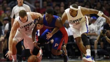 Nov 14, 2015; Los Angeles, CA, USA; Los Angeles Clippers forward Blake Griffin (left) knocks the ball away from Detroit Pistons guard Reggie Jackson (1) as Los Angeles Clippers forward Paul Pierce (right) defends during the fourth quarter at Staples Center. The Los Angeles Clippers won 101-96. Mandatory Credit: Kelvin Kuo-USA TODAY Sports