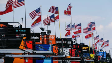 May 26, 2016; Concord, NC, USA; American and Patriotic flags fly over haulers during qualifying for the Coca-Cola 600 at Charlotte Motor Speedway. Mandatory Credit: Jim Dedmon-USA TODAY Sports