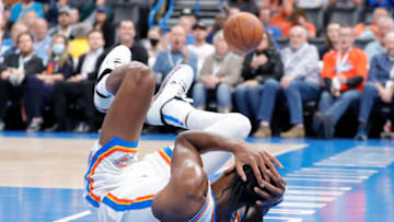 OKC Thunder guard Shai Gilgeous-Alexander (2) grabs his head after hitting the floor following a foul : Alonzo Adams-USA TODAY Sports