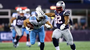 FOXBOROUGH, MA - JANUARY 13: Erick Decker #87 of the Tennessee Titans carries the ball after a catch as he is defended by James Harrison #92 of the New England Patriots in the second quarter of the AFC Divisional Playoff game at Gillette Stadium on January 13, 2018 in Foxborough, Massachusetts. (Photo by Maddie Meyer/Getty Images)