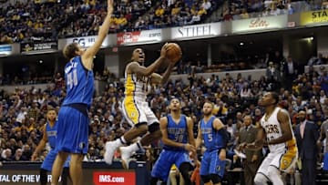 Oct 26, 2016; Indianapolis, IN, USA; Indiana Pacers guard Jeff Teague (44) takes a shot against Dallas Mavericks forward Dirk Nowitski (41) at Bankers Life Fieldhouse. Indiana defeats Dallas 130-121 in overtime. Mandatory Credit: Brian Spurlock-USA TODAY Sports