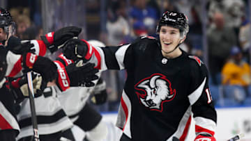 BUFFALO, NEW YORK - DECEMBER 13: Peyton Krebs #19 of the Buffalo Sabres celebrates after scoring a goal during the third period of an NHL hockey game against the Los Angeles Kings at KeyBank Center on December 13, 2022 in Buffalo, New York. (Photo by Joshua Bessex/Getty Images)