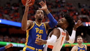 SYRACUSE, NEW YORK - JANUARY 25: Terrell Brown #21 of the Pittsburgh Panthers attempts to grab the ball as Quincy Guerrier #1 of the Syracuse Orange is called for a foul during the second half of an NCAA basketball game at the Carrier Dome on January 25, 2020 in Syracuse, New York. (Photo by Bryan Bennett/Getty Images)