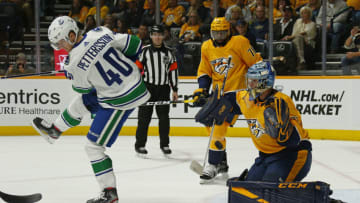 NASHVILLE, TENNESSEE - APRIL 04: Elias Pettersson #40 of the Vancouver Canucks screens goalie Pekka Rinne #35 of the Nashville Predators during the second period at Bridgestone Arena on April 04, 2019 in Nashville, Tennessee. (Photo by Frederick Breedon/Getty Images)