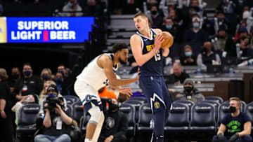 Nikola Jokic #15 of the Denver Nuggets competes while Karl-Anthony Towns #32 of the Minnesota Timberwolves defends in the third quarter of the game at Target Center on 1 Feb. 2022 in Minneapolis, Minnesota. The Timberwolves defeated the Nuggets 130-115.(Photo by David Berding/Getty Images)