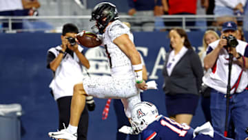 Oct 8, 2022; Tucson, Arizona, USA; Oregon Ducks quarterback Bo Nix (10) runs for a touchdown against the Arizona Wildcats during the second half at Arizona Stadium. Mandatory Credit: Mark J. Rebilas-USA TODAY Sports