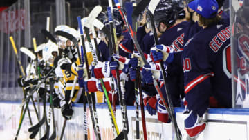 NEW YORK, NEW YORK - APRIL 08: Both benches salute Brendan Smith #42 of the New York Rangers and Sam Lafferty #18 of the Pittsburgh Penguins following their second period fight at Madison Square Garden on April 08, 2021 in New York City. (Photo by Bruce Bennett/Getty Images)