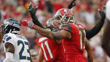 Nov 27, 2016; Tampa, FL, USA; Tampa Bay Buccaneers wide receiver Mike Evans (13) celebrates a touchdown with wide receiver Adam Humphries (11) during the first quarter of an NFL football game against the Seattle Seahawks at Raymond James Stadium. Mandatory Credit: Reinhold Matay-USA TODAY Sports