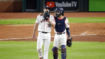 HOUSTON, TEXAS - OCTOBER 29: Justin Verlander #35 of the Houston Astros gets a mound visit from Robinson Chirinos #28 against the Washington Nationals during the fourth inning in Game Six of the 2019 World Series at Minute Maid Park on October 29, 2019 in Houston, Texas. (Photo by Tim Warner/Getty Images)