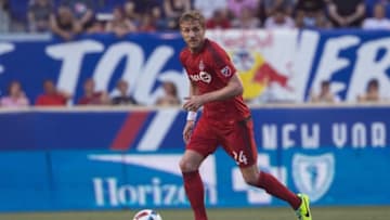May 28, 2016; Harrison, NJ, USA; Toronto FC defender Damien Perquis (24) in action against the New York Red Bulls at Red Bull Arena. The New York Red Bulls won 3-0. Mandatory Credit: Bill Streicher-USA TODAY Sports