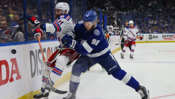 TAMPA, FLORIDA - JUNE 05: Mikhail Sergachev #98 of the Tampa Bay Lightning checks Barclay Goodrow #21 of the New York Rangers during the first period in Game Three of the Eastern Conference Final of the 2022 Stanley Cup Playoffs at Amalie Arena on June 05, 2022 in Tampa, Florida. (Photo by Bruce Bennett/Getty Images)