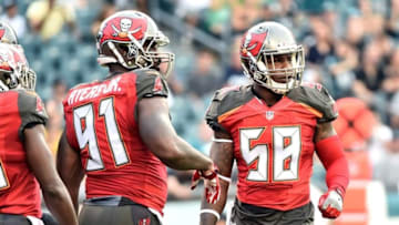 Aug 11, 2016; Philadelphia, PA, USA; Tampa Bay Buccaneers linebacker Robert Ayers (91) and middle linebacker Kwon Alexander (58) get signals from the sidelines against the Philadelphia Eagles at Lincoln Financial Field. The Eagles defeated the Buccaneers, 17-9. Mandatory Credit: Eric Hartline-USA TODAY Sports