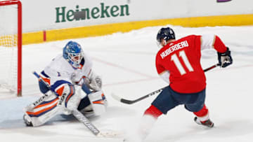 SUNRISE, FL - APRIL 04: Goaltender Thomas Greiss #1 of the New York Islanders stops a shot by Jonathan Huberdeau #11 of the Florida Panthers during the shootout at the BB&T Center on April 4, 2019 in Sunrise, Florida. The Islanders defeated the Panthers 2-1 in a shootout. (Photo by Joel Auerbach/Icon Sportswire via Getty Images)
