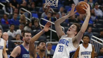Dec 28, 2016; Orlando, FL, USA; Orlando Magic center Stephen Zimmerman (33) shoots over Charlotte Hornets guard Jeremy Lamb (3) as Magic guard CJ Wilcox (23) and Hornets center Frank Kaminsky III (44) look on during the second half of an NBA basketball game at Amway Center.The Hornets won 120-101. Mandatory Credit: Reinhold Matay-USA TODAY Sports