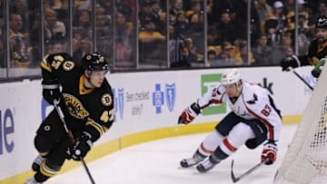 Mar 5, 2016; Boston, MA, USA; Boston Bruins defenseman Torey Krug (47) skates past Washington Capitals center Jay Beagle (83) during the first period at TD Garden. Mandatory Credit: Bob DeChiara-USA TODAY Sports