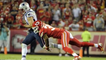 Sep 29, 2014; Kansas City, MO, USA; Kansas City Chiefs cornerback Marcus Cooper (31) breaks up a pass intended for New England Patriots wide receiver Julian Edelman (11) in the first half at Arrowhead Stadium. Mandatory Credit: John Rieger-USA TODAY Sports