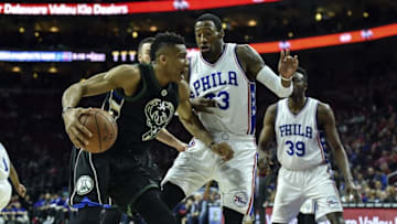 Apr 10, 2016; Philadelphia, PA, USA; Milwaukee Bucks forward Giannis Antetokounmpo (34) drives to the net as Philadelphia 76ers forward Robert Covington (33) defends during the first quarter of the game at the Wells Fargo Center. Mandatory Credit: John Geliebter-USA TODAY Sports