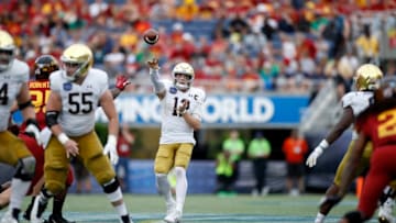 ORLANDO, FL - DECEMBER 28: Ian Book #12 of the Notre Dame Fighting Irish passes the ball during the Camping World Bowl against the Iowa State Cyclones at Camping World Stadium on December 28, 2019 in Orlando, Florida. Notre Dame defeated Iowa State 33-9. (Photo by Joe Robbins/Getty Images)