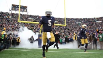 Nov 15, 2014; South Bend, IN, USA; Notre Dame Fighting Irish quarterback Everett Golson (5) runs onto the field before the against the Northwestern Wildcats at Notre Dame Stadium. Mandatory Credit: Brian Spurlock-USA TODAY Sports