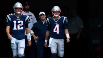 MIAMI, FLORIDA - SEPTEMBER 15: Tom Brady #12 and Jarrett Stidham #4 of the New England Patriots take to field prior to the game against the Miami Dolphins at Hard Rock Stadium on September 15, 2019 in Miami, Florida. (Photo by Mark Brown/Getty Images)