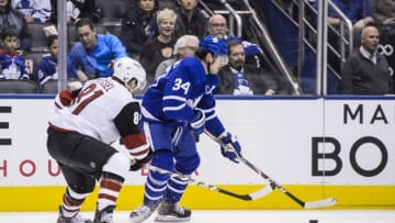 TORONTO, ON - FEBRUARY 11: Auston Matthews #34 of the Toronto Maple Leafs plays the puck against Phil Kessel #81 of the Arizona Coyotes during the first period at the Scotiabank Arena on February 11, 2020 in Toronto, Ontario, Canada. (Photo by Andrew Lahodynskyj/NHLI via Getty Images)