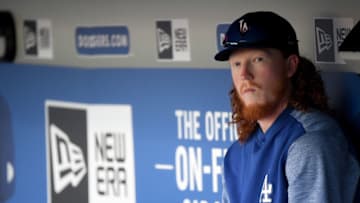 LOS ANGELES, CALIFORNIA - AUGUST 05: Dustin May #85 of the Los Angeles Dodgers sits in the dugout before the game against the St. Louis Cardinals at Dodger Stadium on August 05, 2019 in Los Angeles, California. (Photo by Harry How/Getty Images)