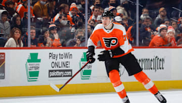 PHILADELPHIA, PENNSYLVANIA - FEBRUARY 09: Isaac Ratcliffe #76 of the Philadelphia Flyers chases the puck during the third period against the Detroit Red Wings at Wells Fargo Center on February 09, 2022 in Philadelphia, Pennsylvania. (Photo by Tim Nwachukwu/Getty Images)