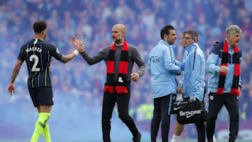 LONDON, ENGLAND - MARCH 30: Josep Guardiola, Manager of Manchester City congratulates Kyle Walker of Manchester City following the Premier League match between Fulham FC and Manchester City at Craven Cottage on March 30, 2019 in London, United Kingdom. (Photo by Richard Heathcote/Getty Images)