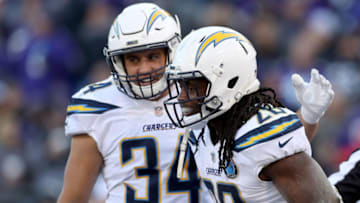 BALTIMORE, MARYLAND - JANUARY 06: Melvin Gordon #28 of the Los Angeles Chargers celebrates with Derek Watt #34 after scoring a one yard touchdown against the Baltimore Ravens during the fourth quarter in the AFC Wild Card Playoff game at M&T Bank Stadium on January 06, 2019 in Baltimore, Maryland. (Photo by Rob Carr/Getty Images)
