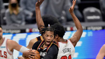 Apr 21, 2021; Cleveland, Ohio, USA; Cleveland Cavaliers guard Darius Garland (10) rebounds against Chicago Bulls forward Thaddeus Young (21) in the second quarter at Rocket Mortgage FieldHouse. Mandatory Credit: David Richard-USA TODAY Sports