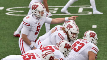 Dec 12, 2020; Iowa City, Iowa, USA; Wisconsin Badgers quarterback Graham Mertz (5) leads the offense against the Iowa Hawkeyes during the first quarter at Kinnick Stadium. Mandatory Credit: Jeffrey Becker-USA TODAY Sports