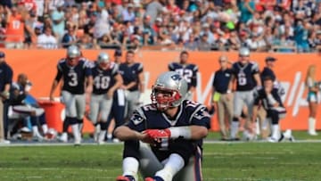 Dec 15, 2013; Miami Gardens, FL, USA: New England Patriots quarterback Tom Brady (12) reacts after an incomplete pass against the Miami Dolphins in the fourth quarter at Sun Life Stadium. The Dolphins won 24-20. Mandatory Credit: Robert Mayer-USA TODAY Sports