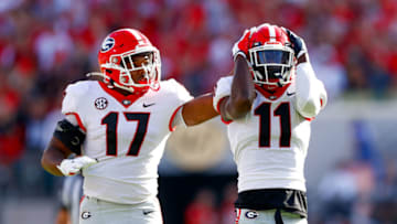 Oct 30, 2021; Jacksonville, Florida, USA; Georgia Bulldogs defensive back Derion Kendrick (11) and linebacker Nakobe Dean (17) react after a play in the first half against the Florida Gators at TIAA Bank Field. Mandatory Credit: Nathan Ray Seebeck-USA TODAY Sports