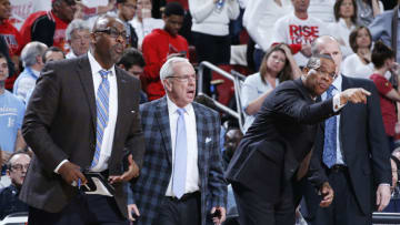 LOUISVILLE, KY - JANUARY 31: Head coach Roy Williams and assistant coaches Hubert Davis (right) and Steve Robinson (left) of the North Carolina Tar Heels react during the game against the Louisville Cardinals at KFC Yum! Center on January 31, 2015 in Louisville, Kentucky. Louisville defeated North Carolina 78-68 in overtime. (Photo by Joe Robbins/Getty Images)