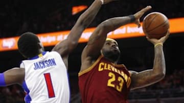 Feb 24, 2015; Auburn Hills, MI, USA; Cleveland Cavaliers forward LeBron James (23) takes a shot against Detroit Pistons guard Reggie Jackson (1) during the first quarter at The Palace of Auburn Hills. Mandatory Credit: Raj Mehta-USA TODAY Sports