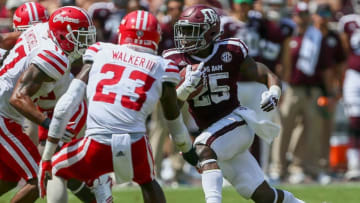 COLLEGE STATION, TX - SEPTEMBER 16: Kendall Bussey #25 of the Texas A&M Aggies rushes with the ball as Tracy Walker #23 of the Louisiana-Lafayette Ragin Cajuns attempts to make a tackle at Kyle Field on September 16, 2017 in College Station, Texas. (Photo by Bob Levey/Getty Images)