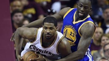 Jun 16, 2015; Cleveland, OH, USA; Cleveland Cavaliers center Tristan Thompson (13) fights for a rebound against Golden State Warriors forward Draymond Green (23) during the second quarter in game six of the NBA Finals at Quicken Loans Arena. Mandatory Credit: Bob Donnan-USA TODAY Sports