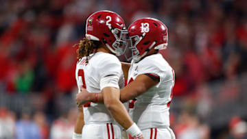 ATLANTA, GA - JANUARY 08: Alabama Crimson Tide quarterback Tua Tagovailoa (13) celebrates a touchdown with fellow teammate quarterback Jalen Hurts (2) during the College Football Playoff National Championship Game between the Alabama Crimson Tide and the Georgia Bulldogs on January 8, 2018 at Mercedes-Benz Stadium in Atlanta, GA. The Alabama Crimson Tide won the game in overtime 26-23. (Photo by Todd Kirkland/Icon Sportswire via Getty Images)