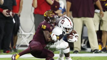 TEMPE, AZ - OCTOBER 18: Aashari Crosswell #16 of the Arizona State Sun Devils tackles Bryce Love #20 of the Stanford Cardinal for a loss of yardage in the first quarter of the game at Sun Devil Stadium on October 18, 2018 in Tempe, Arizona. (Photo by Joe Robbins/Getty Images)