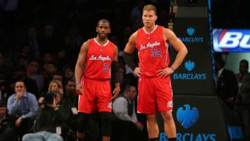 Feb 2, 2015; Brooklyn, NY, USA; Los Angeles Clippers point guard Chris Paul (3) and Los Angeles Clippers power forward Blake Griffin (32) react during the third quarter against the Brooklyn Nets at Barclays Center. The Nets defeated the Clippers 102-100. Mandatory Credit: Brad Penner-USA TODAY Sports