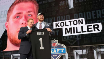 ARLINGTON, TX - APRIL 26: Kolton Miller of UCLA poses with NFL Commissioner Roger Goodell after being picked