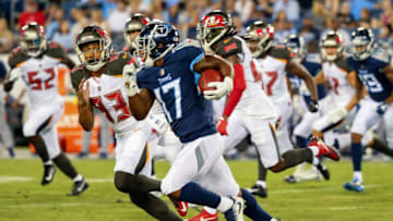 NASHVILLE, TN - AUGUST 18: Cameron Batson #17 of the Tennessee Titans carries the ball against the Tampa Bay Buccaneers during the first half of a pre-season game at Nissan Stadium on August 18, 2018 in Nashville, Tennessee. (Photo by Frederick Breedon/Getty Images)