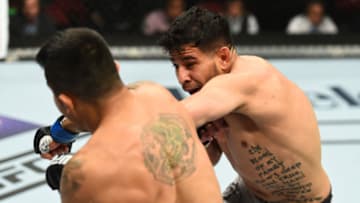 GLENDALE, AZ - APRIL 14: (R-L) Matthew Lopez punches Alejandro Perez of Mexico in their bantamweight fight during the UFC Fight Night event at the Gila Rivera Arena on April 14, 2018 in Glendale, Arizona. (Photo by Josh Hedges/Zuffa LLC/Zuffa LLC via Getty Images)