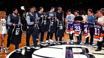 Nov 19, 2014; Brooklyn, NY, USA; Members of the Brooklyn Nets and the New York Islanders exchanges jersey before the Brooklyn Nets and Milwaukee Bucks game at Barclays Center. Mandatory Credit: Noah K. Murray-USA TODAY Sports