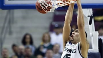 Mar 23, 2013; Auburn Hills, MI, USA; Michigan State Spartans guard Denzel Valentine (45) dunks the ball in the second half against the Memphis Tigers during the third round of the NCAA basketball tournament at The Palace. Michigan State won 70-48. Mandatory Credit: Rick Osentoski-USA TODAY Sports