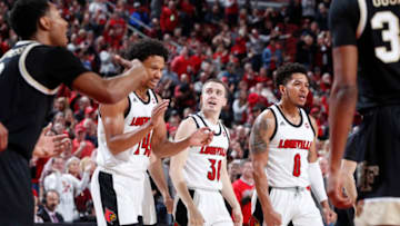 LOUISVILLE, KY - FEBRUARY 05: Ryan McMahon #30 of the Louisville Cardinals celebrates with Dwayne Sutton #24 and Lamarr Kimble #0 after hitting a three-point shot against the Wake Forest Demon Deacons in the second half of a game at KFC YUM! Center on February 5, 2020 in Louisville, Kentucky. Louisville defeated Wake Forest 86-76. (Photo by Joe Robbins/Getty Images)
