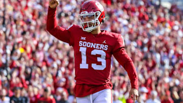 Nov 20, 2021; Norman, Oklahoma, USA; Oklahoma Sooners quarterback Caleb Williams (13) reacts after a touchdown during the fourth quarter against the Iowa State Cyclones at Gaylord Family-Oklahoma Memorial Stadium. Mandatory Credit: Kevin Jairaj-USA TODAY Sports