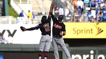 Oct 2, 2016; Kansas City, MO, USA; Cleveland Indians shortstop Francisco Lindor (12) celebrates with right fielder Lonnie Chisenhall (8) after defeating the Kansas City Royals 3-2 at Kauffman Stadium. Mandatory Credit: John Rieger-USA TODAY Sports